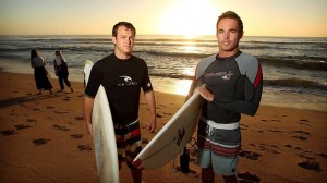 Surfers (L-R) Grant Carter and Pat Hill, are pictured at Dee Why Beach this morning at sunrise before heading out for an early morning surf.